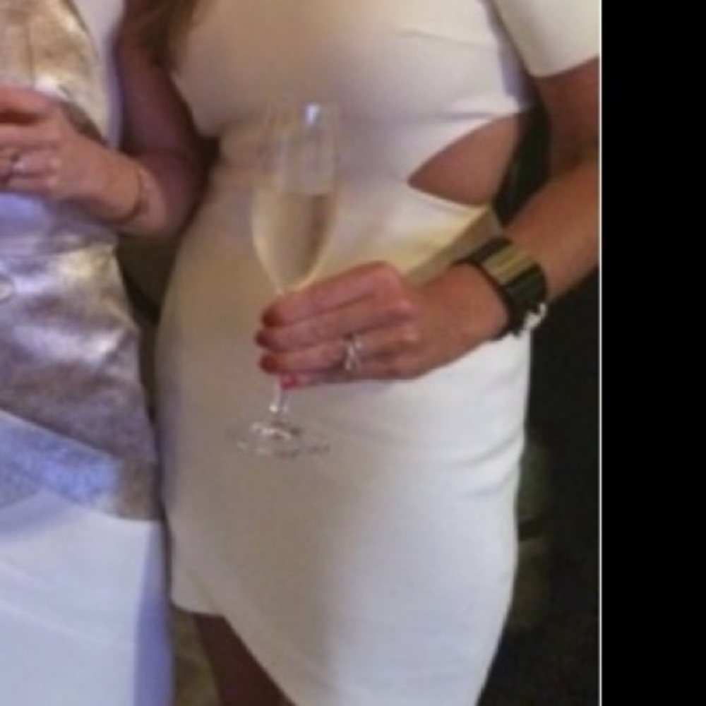 Gorgeous crème cocktail mini dress! Cutouts zip back from Elizabeth and James